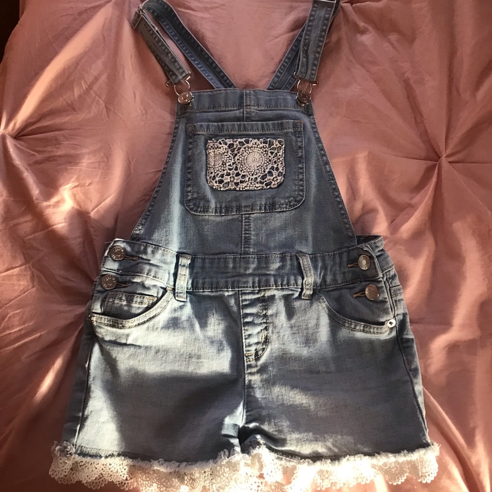 Light blue,cream floral outlining overalls.